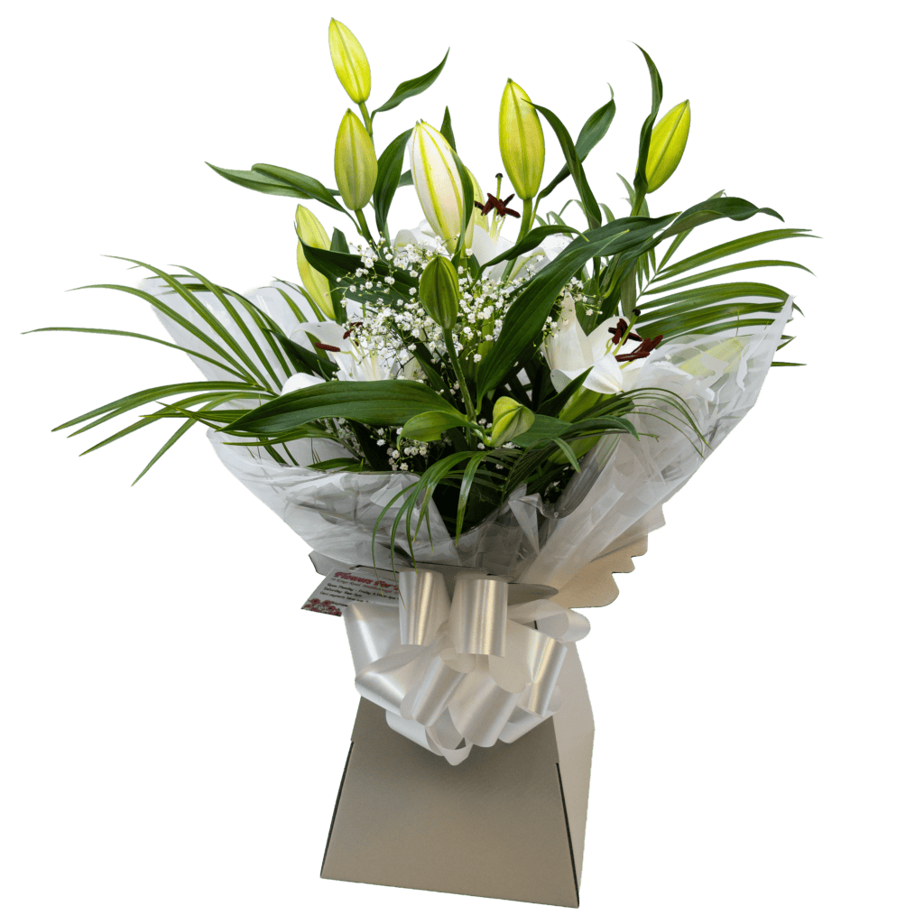 Classic white lilies and baby’s breath, wrapped in cellophane and arranged in an aqua box living vase